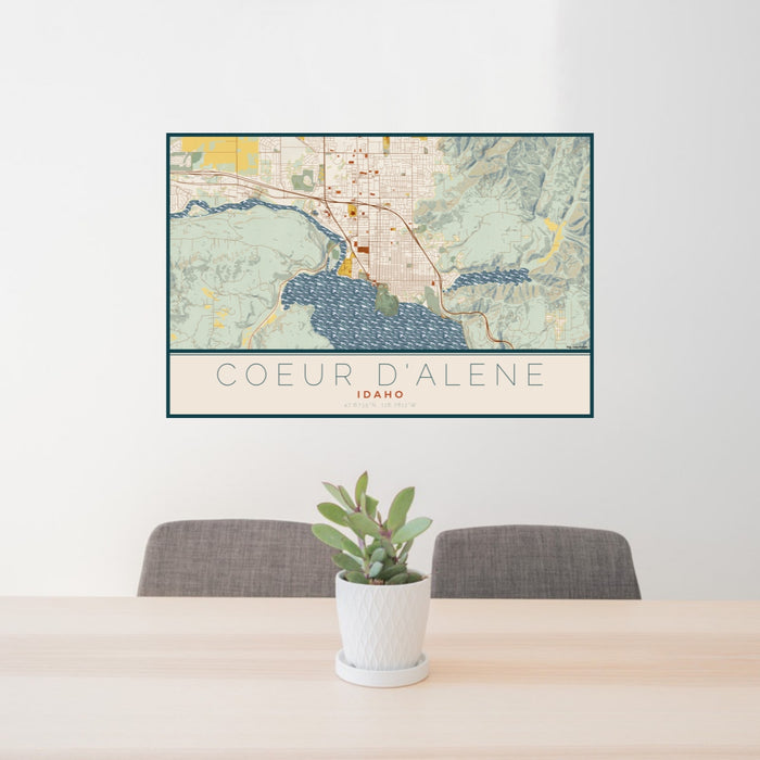24x36 Coeur d'Alene Idaho Map Print Lanscape Orientation in Woodblock Style Behind 2 Chairs Table and Potted Plant