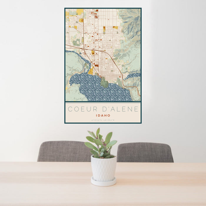 24x36 Coeur d'Alene Idaho Map Print Portrait Orientation in Woodblock Style Behind 2 Chairs Table and Potted Plant