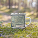 Right View Custom Coeur d'Alene Idaho Map Enamel Mug in Woodblock on Grass With Trees in Background