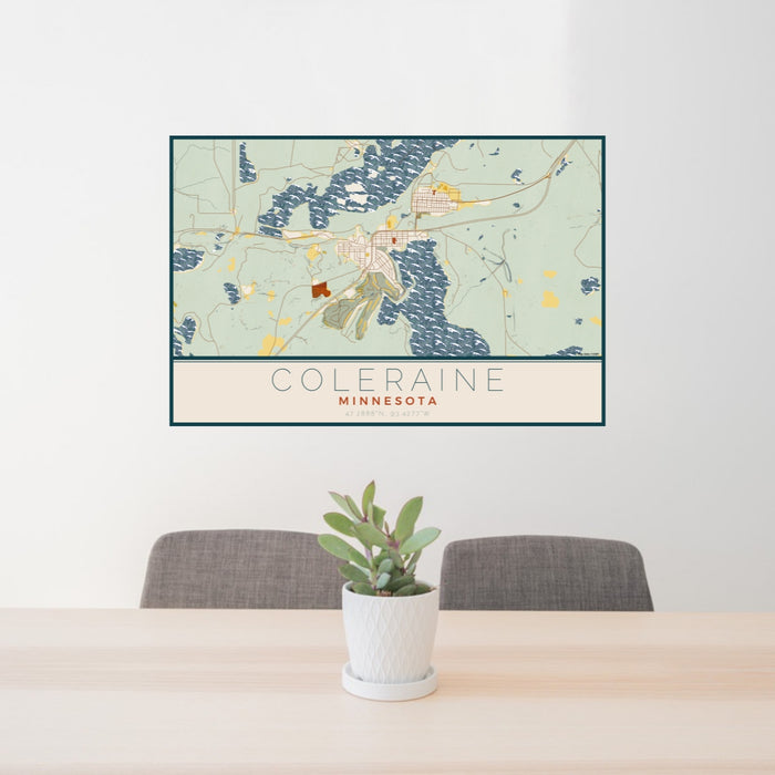 24x36 Coleraine Minnesota Map Print Lanscape Orientation in Woodblock Style Behind 2 Chairs Table and Potted Plant