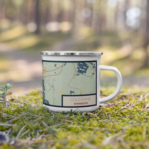 Right View Custom Coleraine Minnesota Map Enamel Mug in Woodblock on Grass With Trees in Background