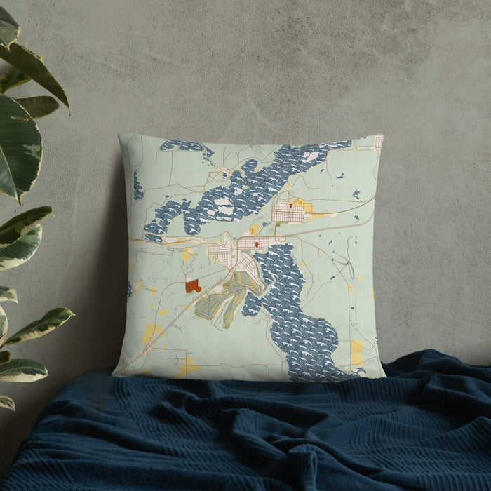 Custom Coleraine Minnesota Map Throw Pillow in Woodblock on Bedding Against Wall