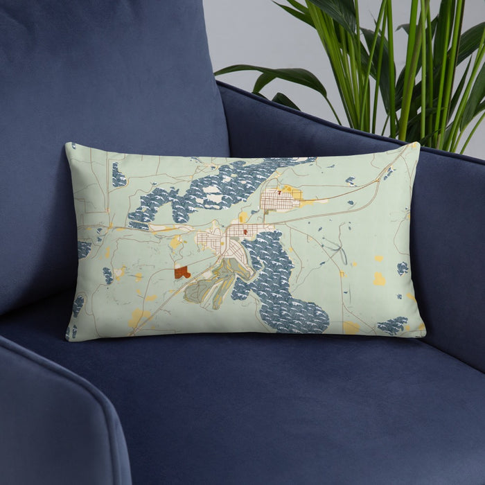 Custom Coleraine Minnesota Map Throw Pillow in Woodblock on Blue Colored Chair