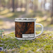 Right View Custom College Station Texas Map Enamel Mug in Ember on Grass With Trees in Background