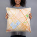 Person holding 18x18 Custom College Station Texas Map Throw Pillow in Watercolor