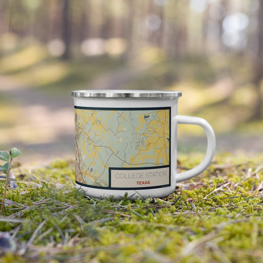 Right View Custom College Station Texas Map Enamel Mug in Woodblock on Grass With Trees in Background