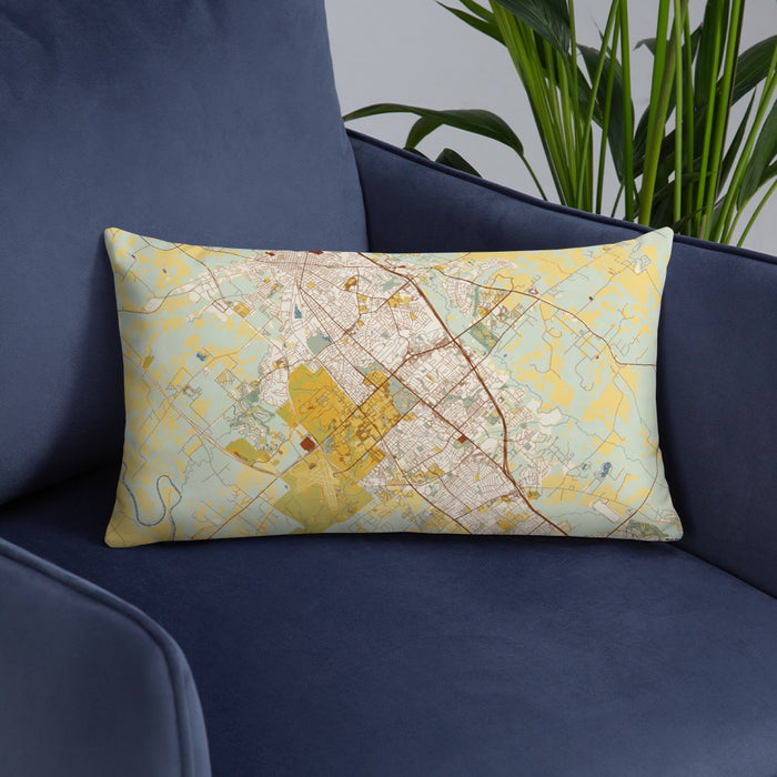 Custom College Station Texas Map Throw Pillow in Woodblock on Blue Colored Chair