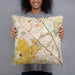 Person holding 18x18 Custom College Station Texas Map Throw Pillow in Woodblock