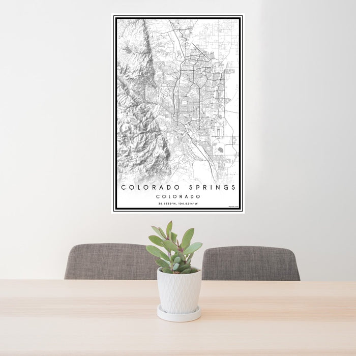 24x36 Colorado Springs Colorado Map Print Portrait Orientation in Classic Style Behind 2 Chairs Table and Potted Plant