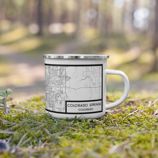 Right View Custom Colorado Springs Colorado Map Enamel Mug in Classic on Grass With Trees in Background