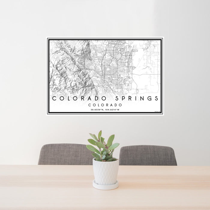24x36 Colorado Springs Colorado Map Print Landscape Orientation in Classic Style Behind 2 Chairs Table and Potted Plant