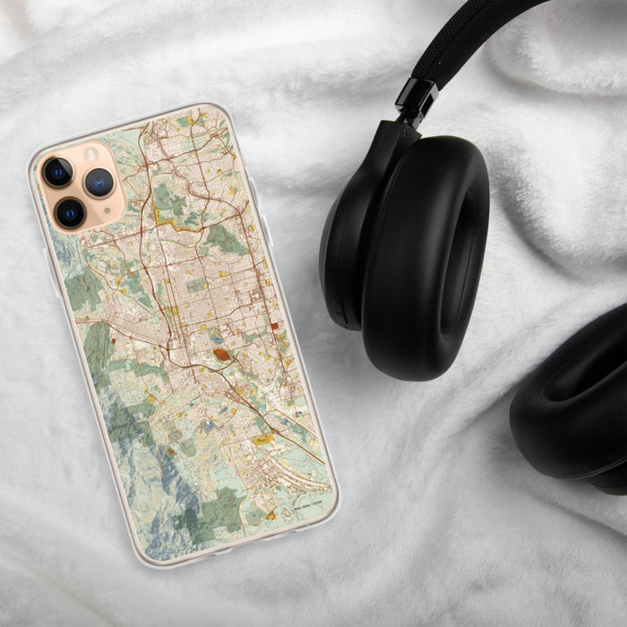 Custom Colorado Springs Colorado Map Phone Case in Woodblock on Table with Black Headphones