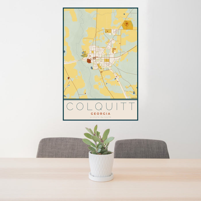 24x36 Colquitt Georgia Map Print Portrait Orientation in Woodblock Style Behind 2 Chairs Table and Potted Plant
