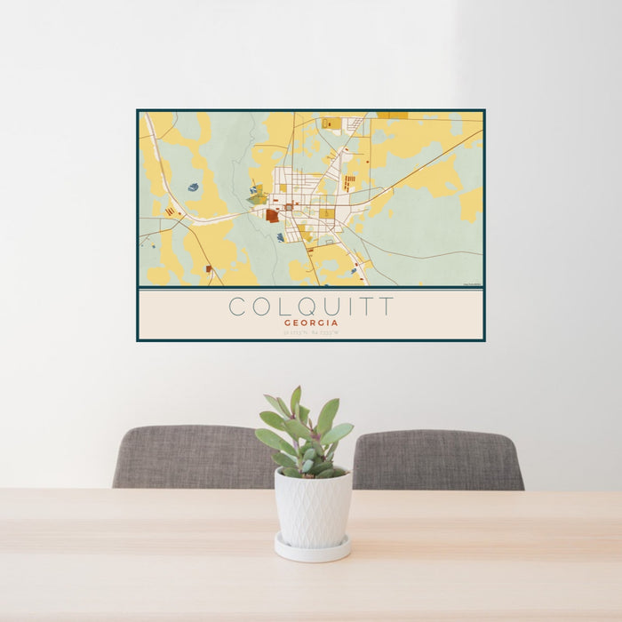 24x36 Colquitt Georgia Map Print Landscape Orientation in Woodblock Style Behind 2 Chairs Table and Potted Plant