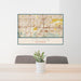 24x36 Colton California Map Print Lanscape Orientation in Woodblock Style Behind 2 Chairs Table and Potted Plant