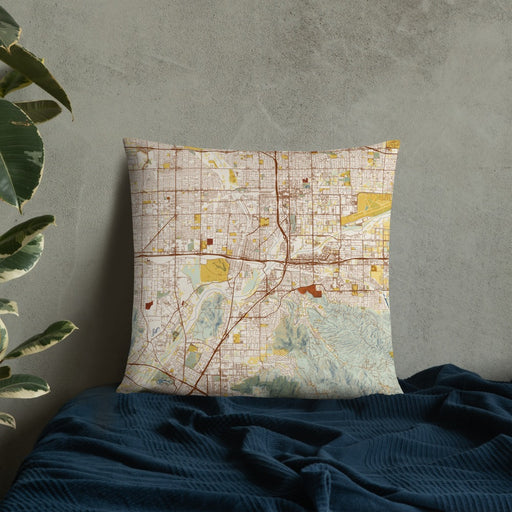 Custom Colton California Map Throw Pillow in Woodblock on Bedding Against Wall