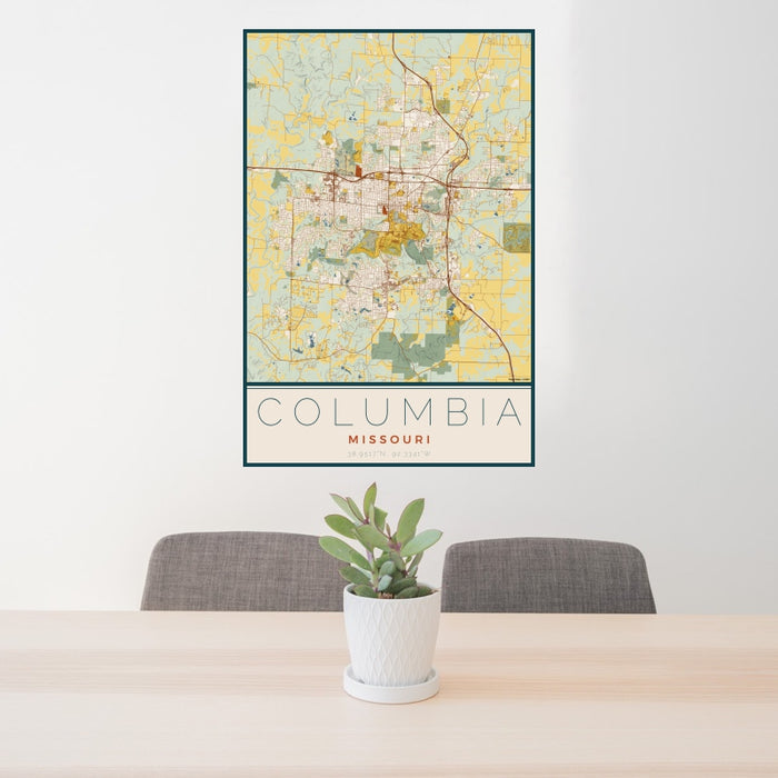 24x36 Columbia Missouri Map Print Portrait Orientation in Woodblock Style Behind 2 Chairs Table and Potted Plant