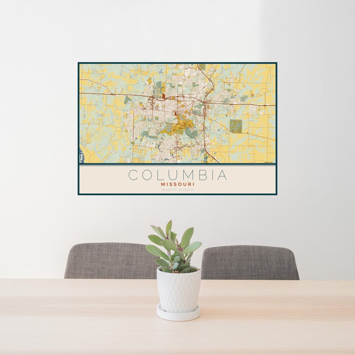 24x36 Columbia Missouri Map Print Landscape Orientation in Woodblock Style Behind 2 Chairs Table and Potted Plant