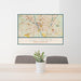 24x36 Columbia South Carolina Map Print Landscape Orientation in Woodblock Style Behind 2 Chairs Table and Potted Plant