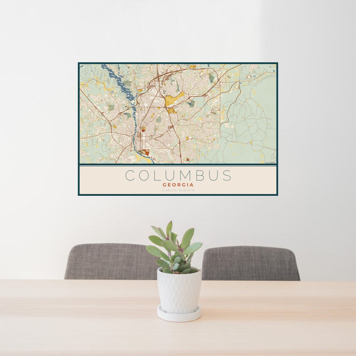 24x36 Columbus Georgia Map Print Landscape Orientation in Woodblock Style Behind 2 Chairs Table and Potted Plant