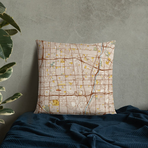 Custom Compton California Map Throw Pillow in Woodblock on Bedding Against Wall