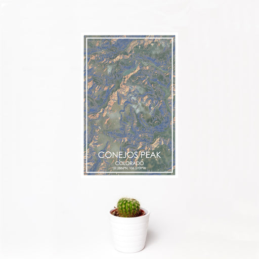 12x18 Conejos Peak Colorado Map Print Portrait Orientation in Afternoon Style With Small Cactus Plant in White Planter