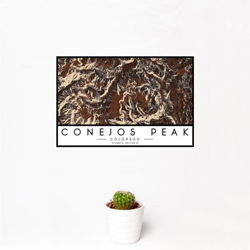 12x18 Conejos Peak Colorado Map Print Landscape Orientation in Ember Style With Small Cactus Plant in White Planter