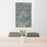 24x36 Conejos Peak Colorado Map Print Portrait Orientation in Afternoon Style Behind 2 Chairs Table and Potted Plant