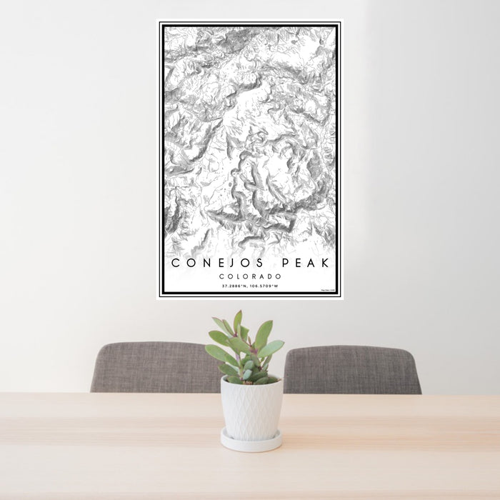 24x36 Conejos Peak Colorado Map Print Portrait Orientation in Classic Style Behind 2 Chairs Table and Potted Plant