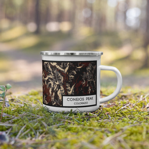 Right View Custom Conejos Peak Colorado Map Enamel Mug in Ember on Grass With Trees in Background