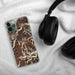 Custom Conejos Peak Colorado Map Phone Case in Ember on Table with Black Headphones