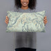 Person holding 20x12 Custom Conejos Peak Colorado Map Throw Pillow in Woodblock