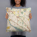 Person holding 18x18 Custom Coon Rapids Minnesota Map Throw Pillow in Woodblock