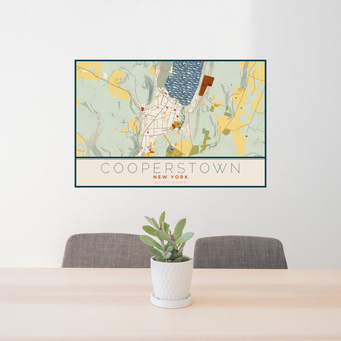24x36 Cooperstown New York Map Print Landscape Orientation in Woodblock Style Behind 2 Chairs Table and Potted Plant