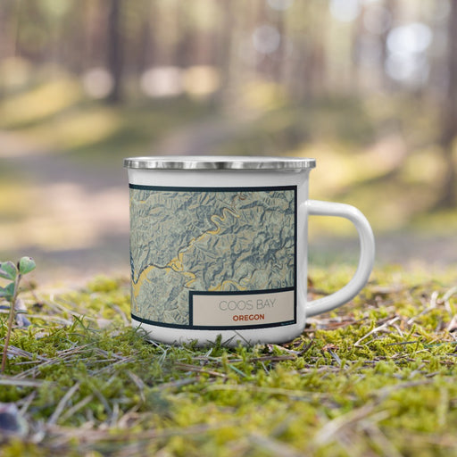 Right View Custom Coos Bay Oregon Map Enamel Mug in Woodblock on Grass With Trees in Background