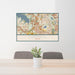 24x36 Coppell Texas Map Print Lanscape Orientation in Woodblock Style Behind 2 Chairs Table and Potted Plant