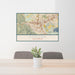 24x36 Corona California Map Print Lanscape Orientation in Woodblock Style Behind 2 Chairs Table and Potted Plant