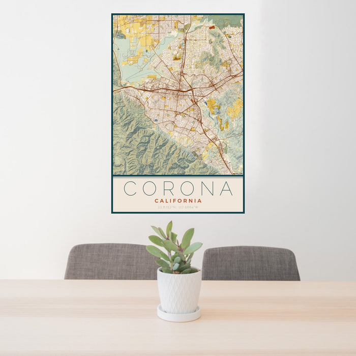 24x36 Corona California Map Print Portrait Orientation in Woodblock Style Behind 2 Chairs Table and Potted Plant