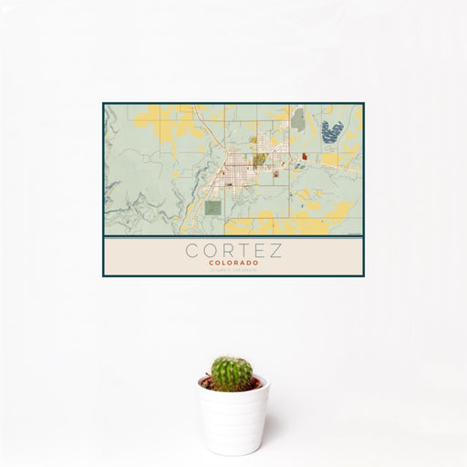 12x18 Cortez Colorado Map Print Landscape Orientation in Woodblock Style With Small Cactus Plant in White Planter