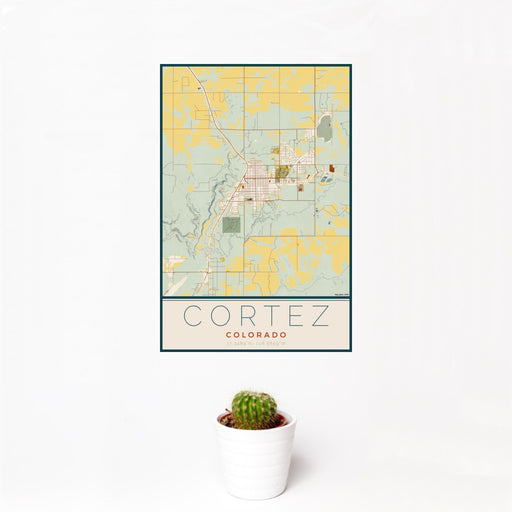 12x18 Cortez Colorado Map Print Portrait Orientation in Woodblock Style With Small Cactus Plant in White Planter