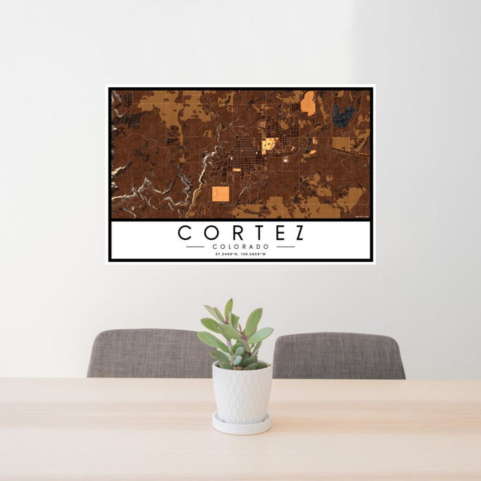 24x36 Cortez Colorado Map Print Lanscape Orientation in Ember Style Behind 2 Chairs Table and Potted Plant