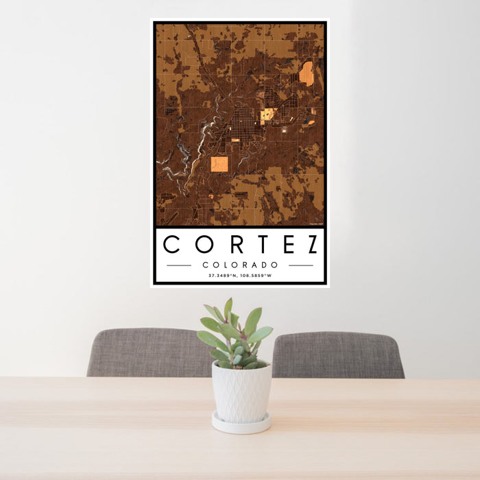 24x36 Cortez Colorado Map Print Portrait Orientation in Ember Style Behind 2 Chairs Table and Potted Plant
