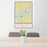 24x36 Cortez Colorado Map Print Portrait Orientation in Woodblock Style Behind 2 Chairs Table and Potted Plant