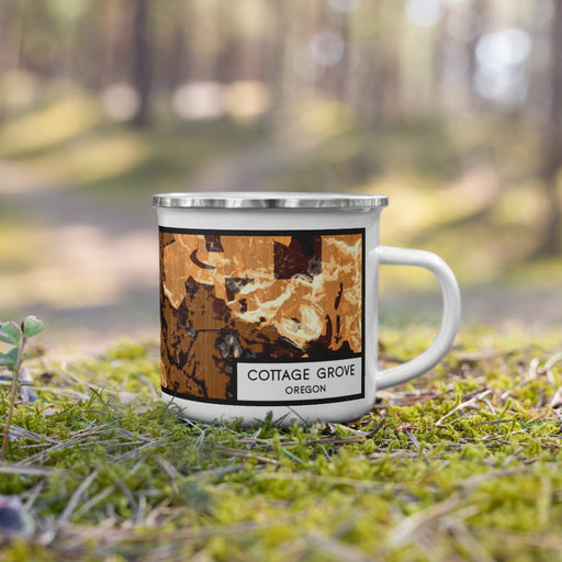 Right View Custom Cottage Grove Oregon Map Enamel Mug in Ember on Grass With Trees in Background
