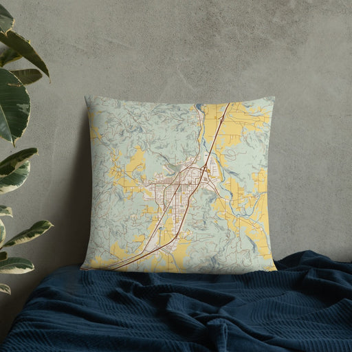 Custom Cottage Grove Oregon Map Throw Pillow in Woodblock on Bedding Against Wall