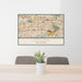 24x36 Covina California Map Print Lanscape Orientation in Woodblock Style Behind 2 Chairs Table and Potted Plant