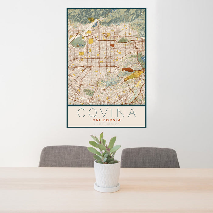 24x36 Covina California Map Print Portrait Orientation in Woodblock Style Behind 2 Chairs Table and Potted Plant