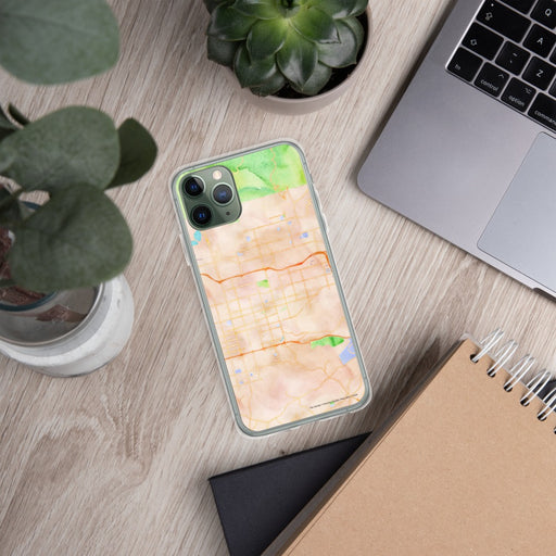 Custom Covina California Map Phone Case in Watercolor on Table with Laptop and Plant
