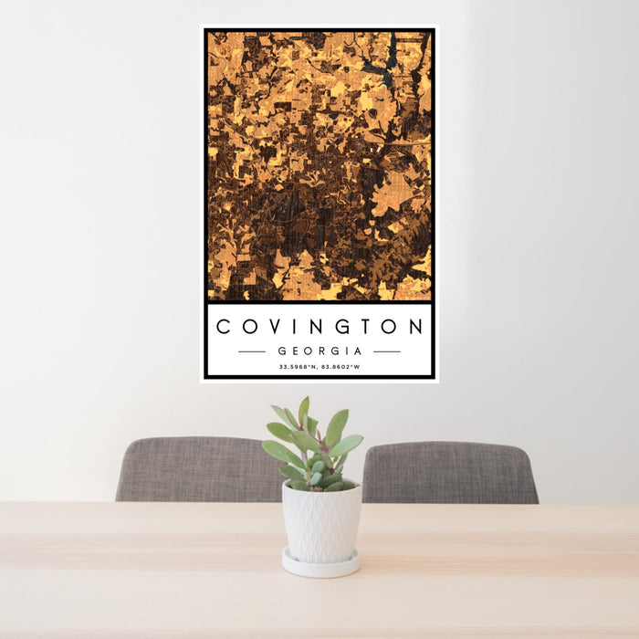 24x36 Covington Georgia Map Print Portrait Orientation in Ember Style Behind 2 Chairs Table and Potted Plant