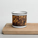Front View Custom Covington Georgia Map Enamel Mug in Ember on Cutting Board